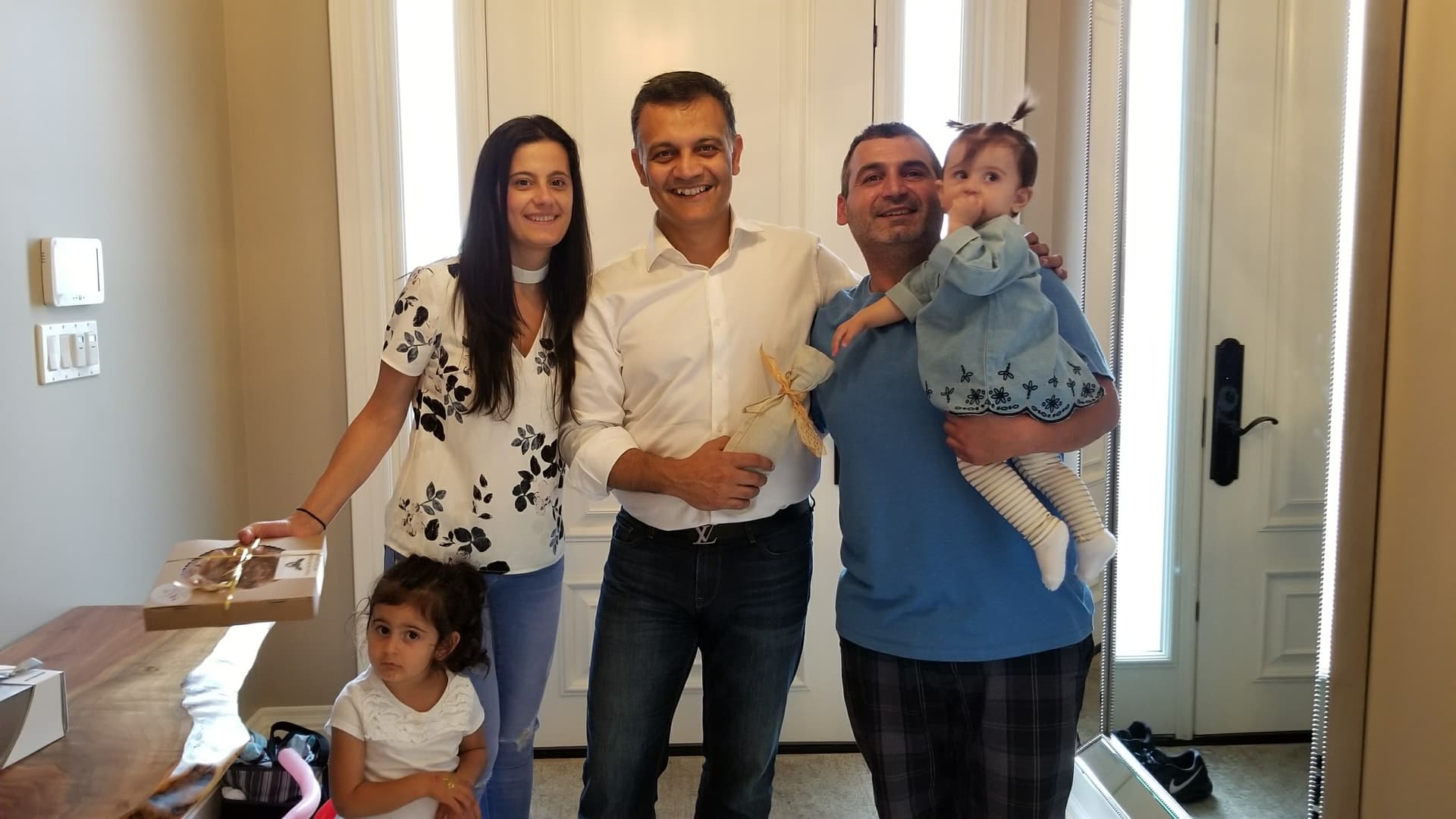 Paul Nagpal with clients at their new home